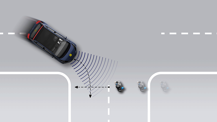 Pedestrian crossing a road into which a car is turning